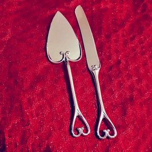 Silver cake knife and cake server.